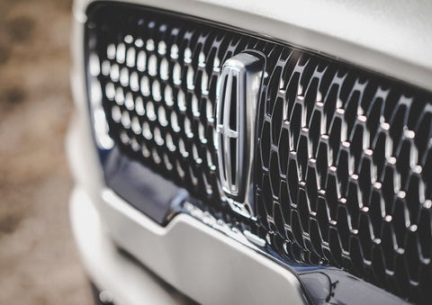 The grille of the 2024 Lincoln Aviator® Reserve model with an eye-catching repeated field of Lincoln Star logo shapes | Beach Lincoln in Myrtle Beach SC